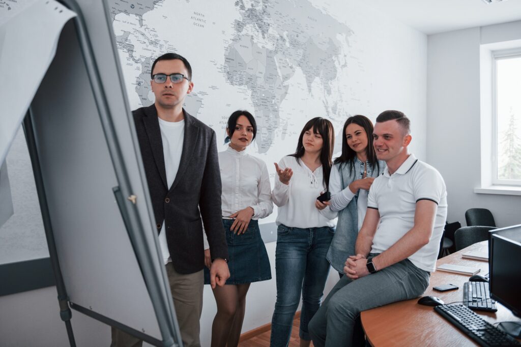 Girl is confused. Business people and manager working on their new project in classroom